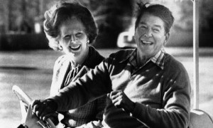 president-ronald-reagan-and-british-prime-minister-margaret-thatcher-smile-as-they-ride-an-electric